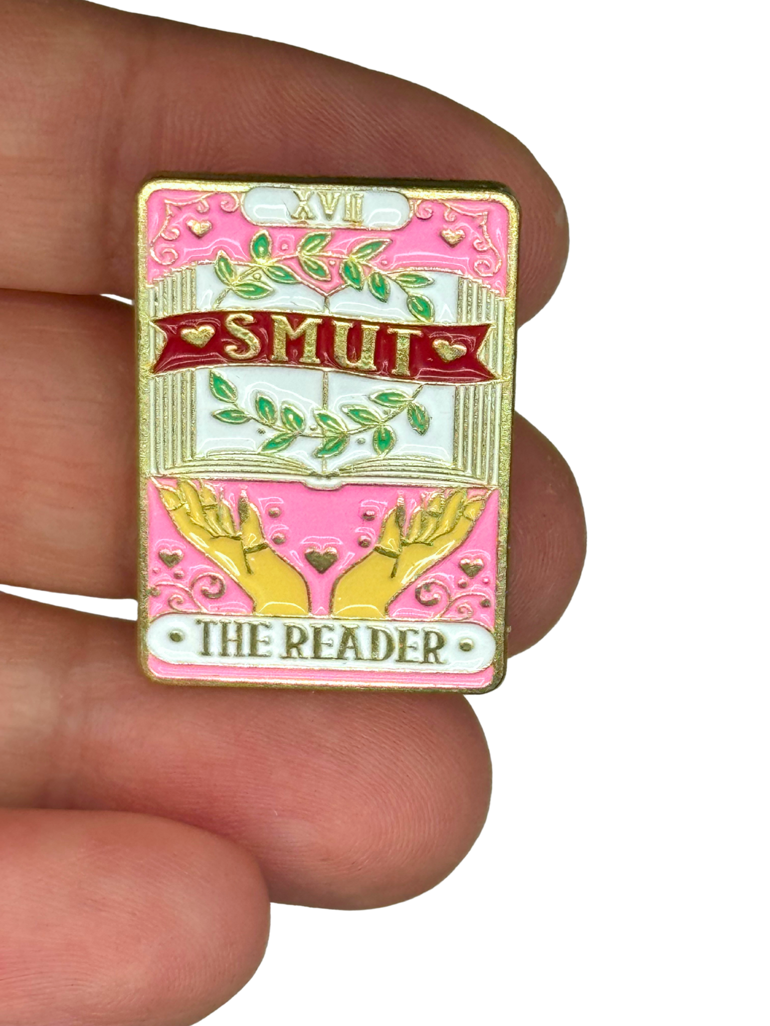 “Smut pin shown on fingers for scale”

