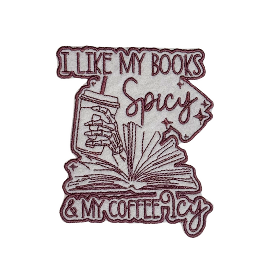 Embroidered patch that says "I Like My Books Spicy & My Coffee Icy" with open book and iced coffee illustration
