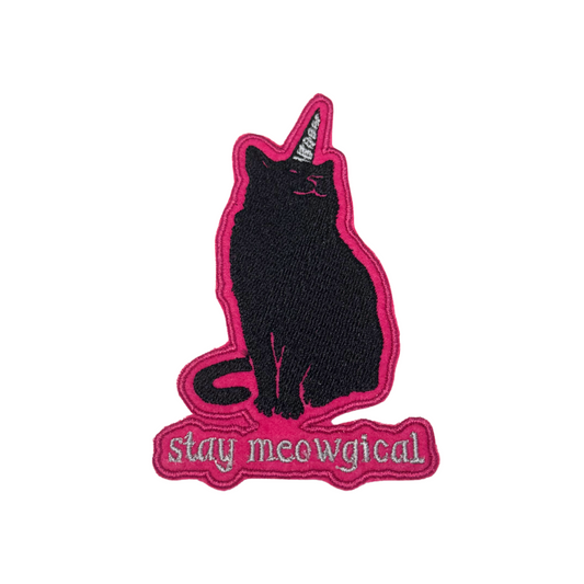 Black embroidered cat patch with unicorn horn and “stay meowgical” text
