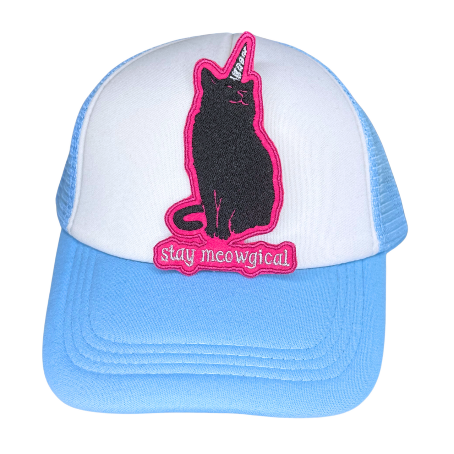 Black cat unicorn patch with pink border on white and blue trucker hat

