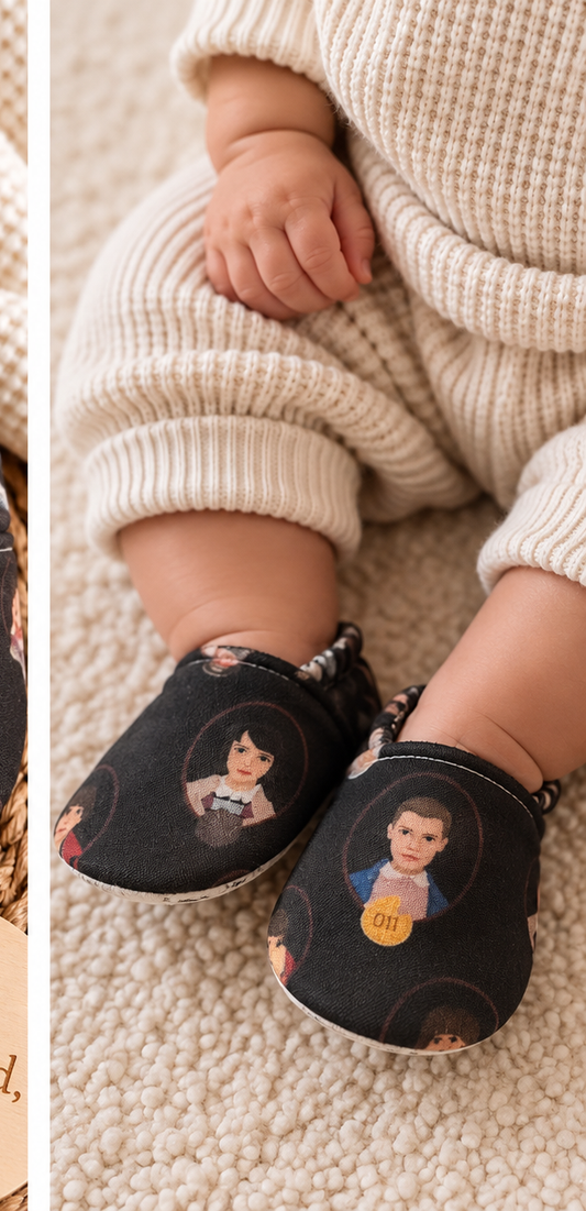 Baby wearing Stranger Things inspired handmade soft sole shoes