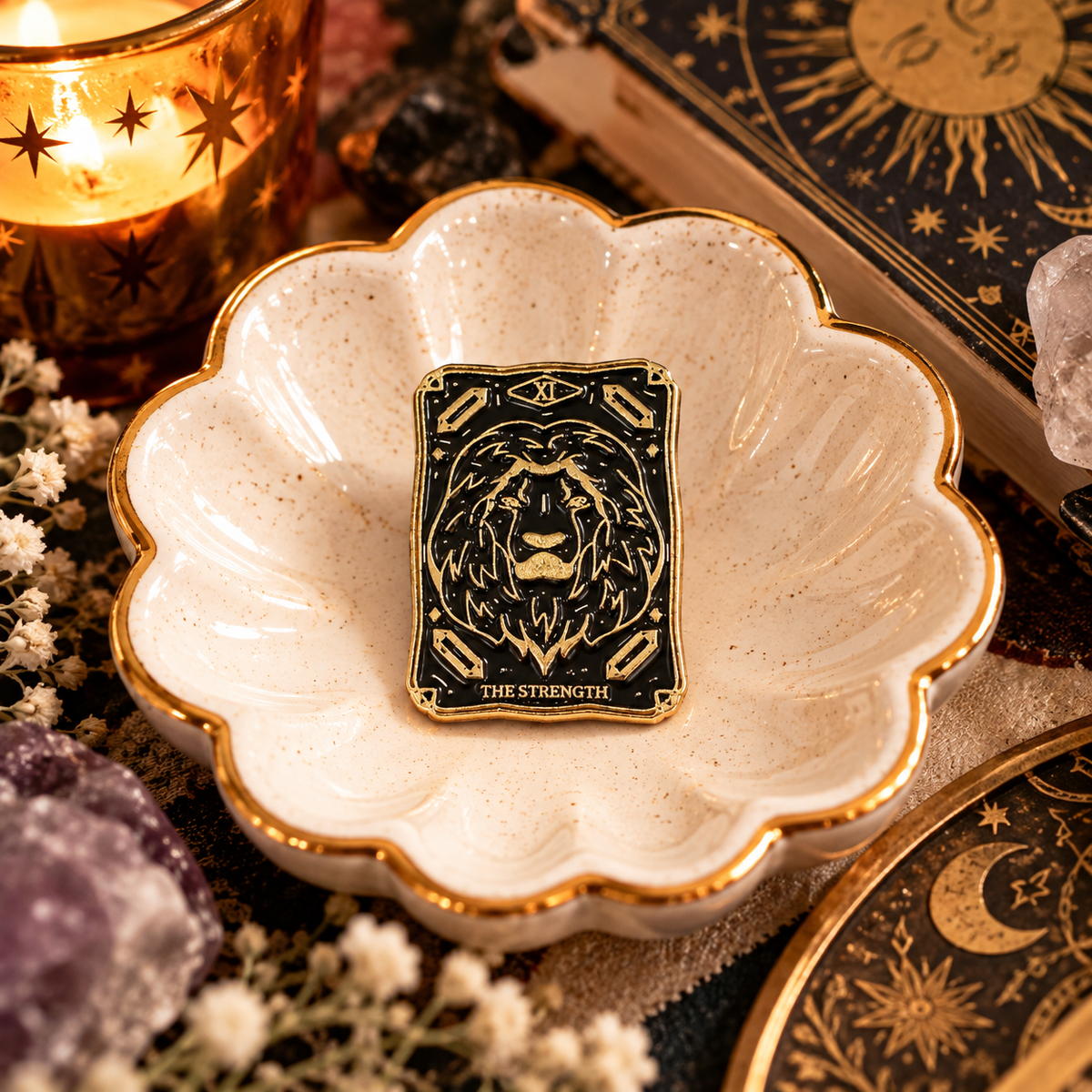The Strength tarot black and gold lion enamel pin styled hero image