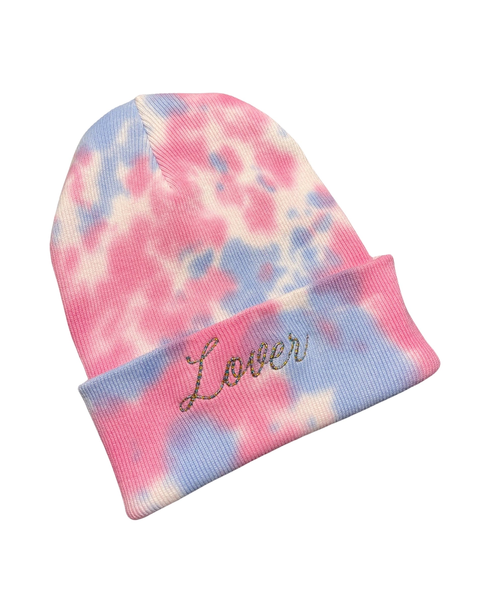 pink and blue tie dye knit beanie embroidered in variegated metallic thread with "LOVER" like the cover to the Taylor Swift Album of the same name