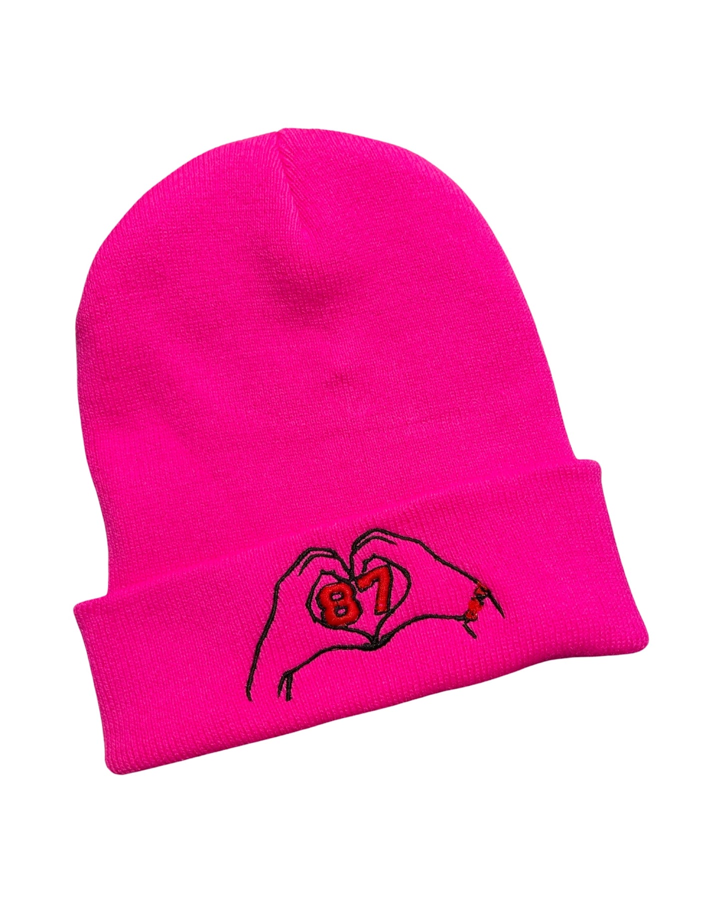 neon pink beanie embroidered with two hands forming a heart with the number 87 inside the heart