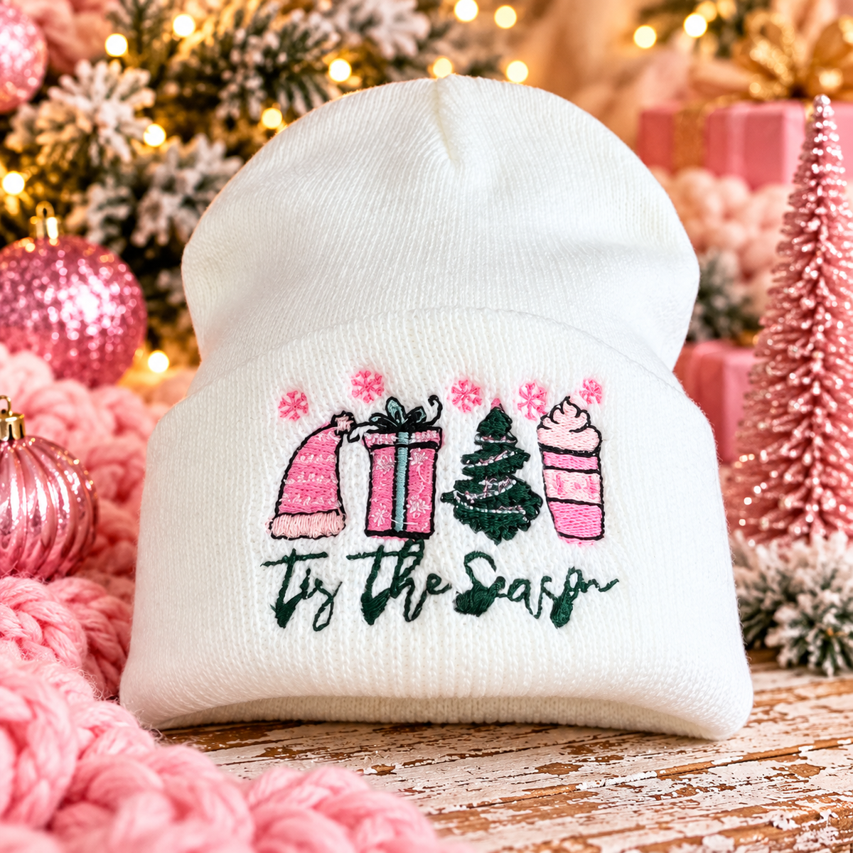 White Tis the Season embroidered beanie styled with pink and green Christmas accents