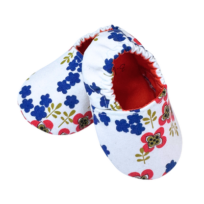 “Side view of vintage floral baby moccasins with red lining, soft sole, handmade, 3-6 months”

