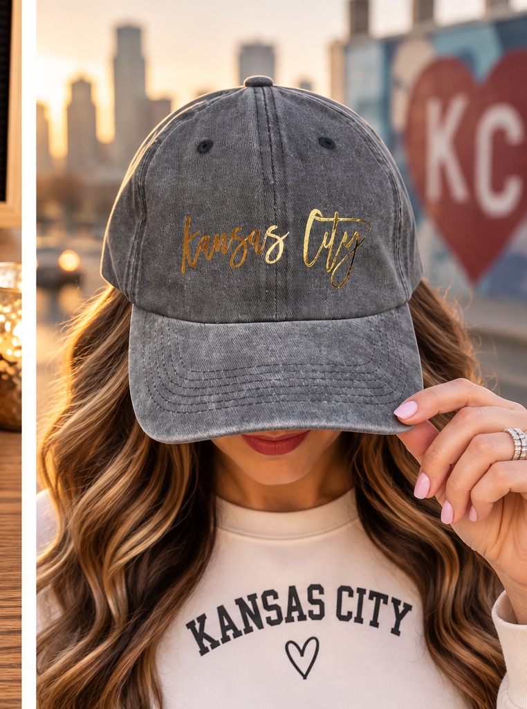 Model wearing washed gray Kansas City baseball hat with gold script
