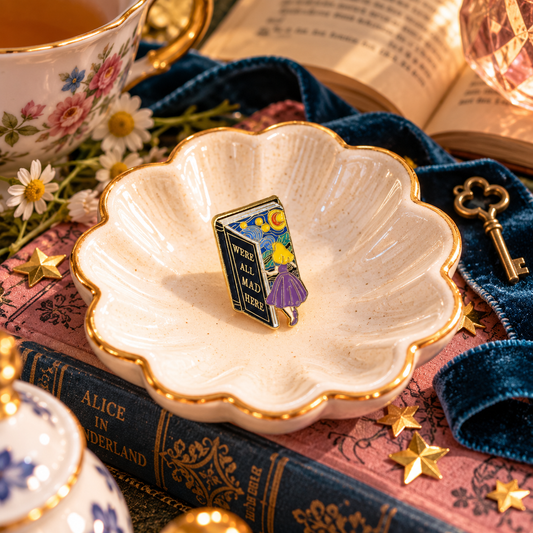 We’re All Mad Here enamel pin whimsical bookish styled hero image