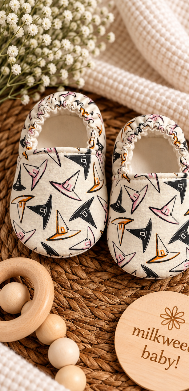 Handmade cream cotton baby shoes with pink orange and black witch hat print, size 0-3 months