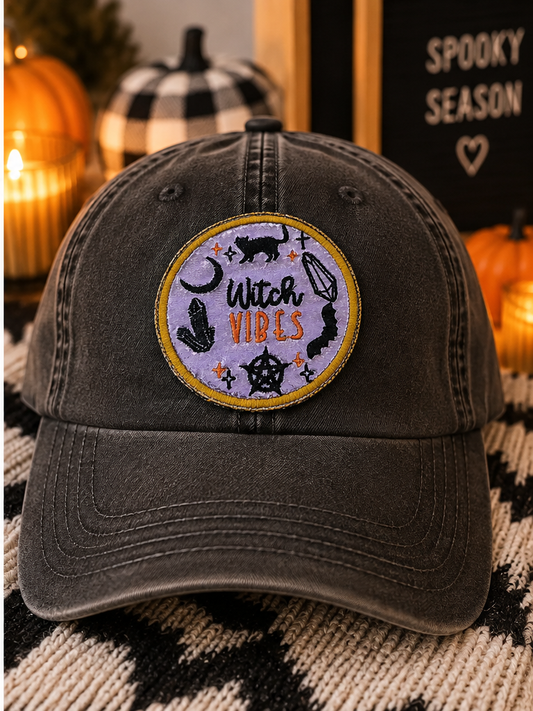 Witch Vibes embroidered patch styled on a washed black dad hat