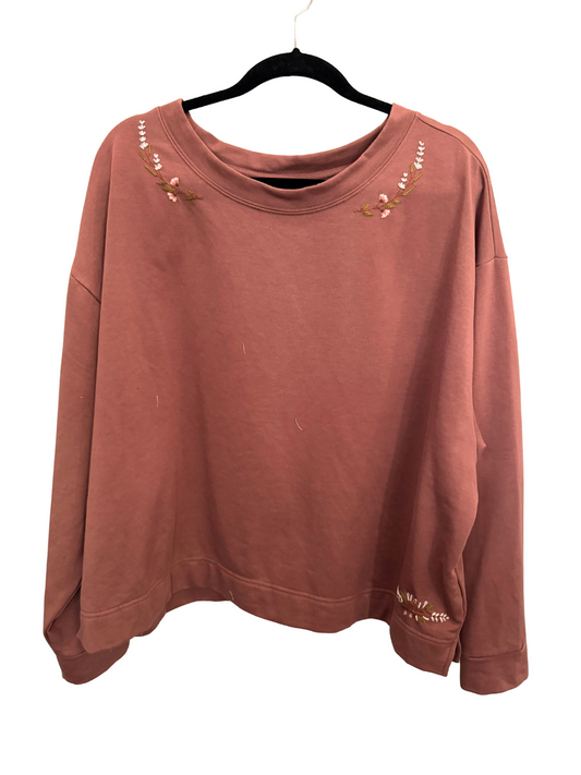 rose pink sweatshirt on a hanger with a white background