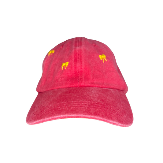 Red cap with yellow bows on a white background