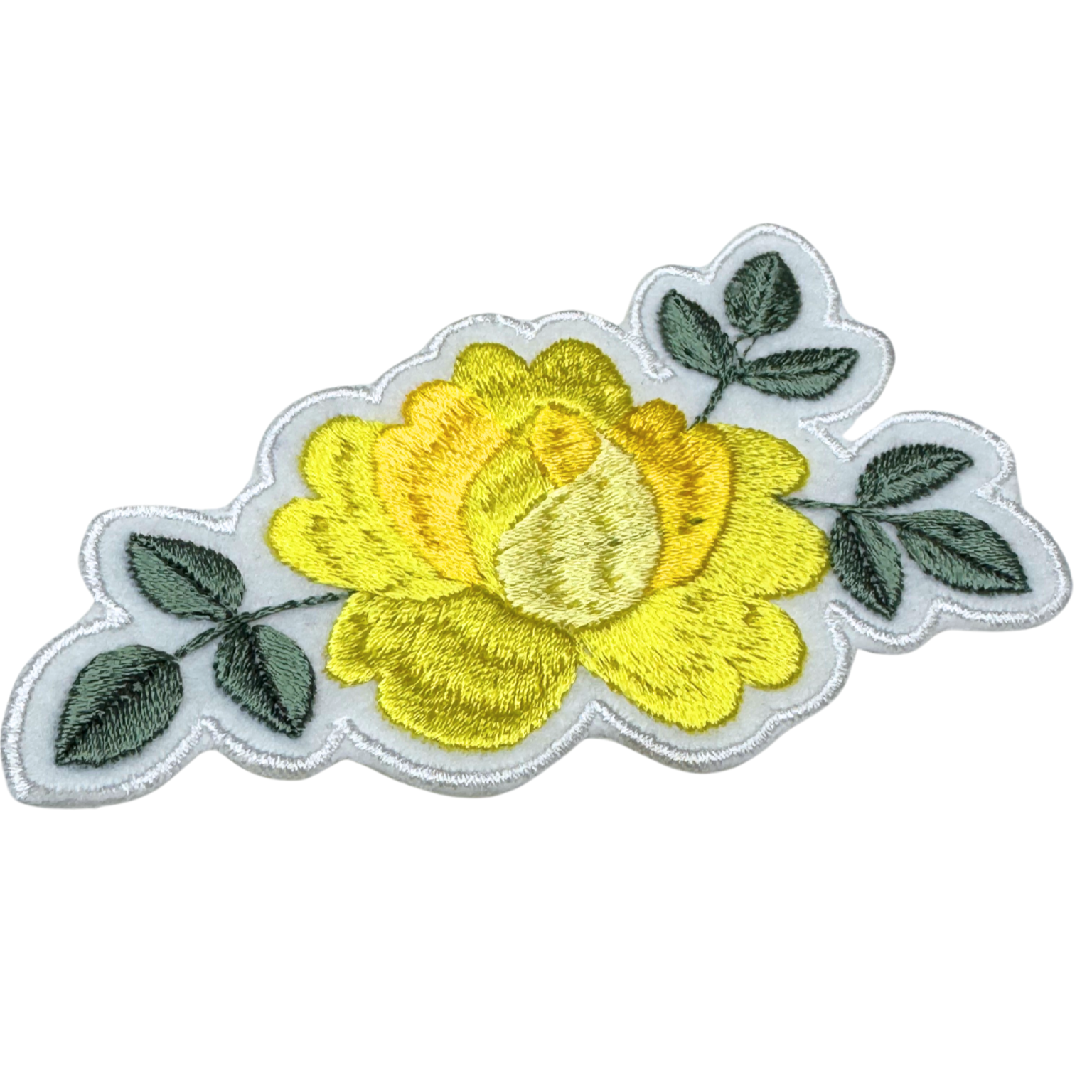 Close-up of yellow rose embroidery with green leaves