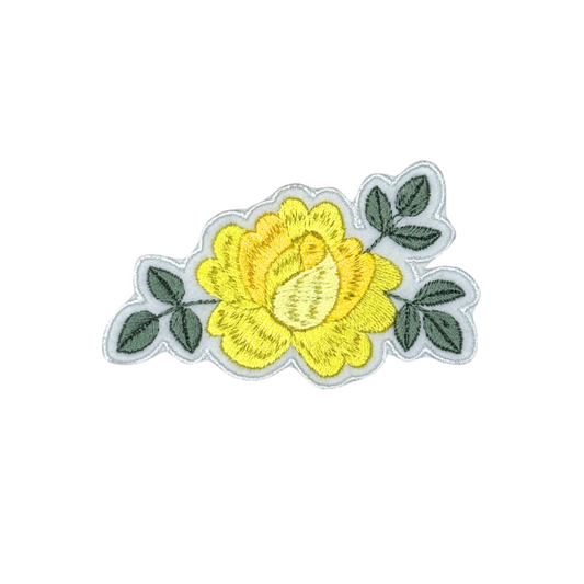 Yellow rose embroidered patch on white background, full view