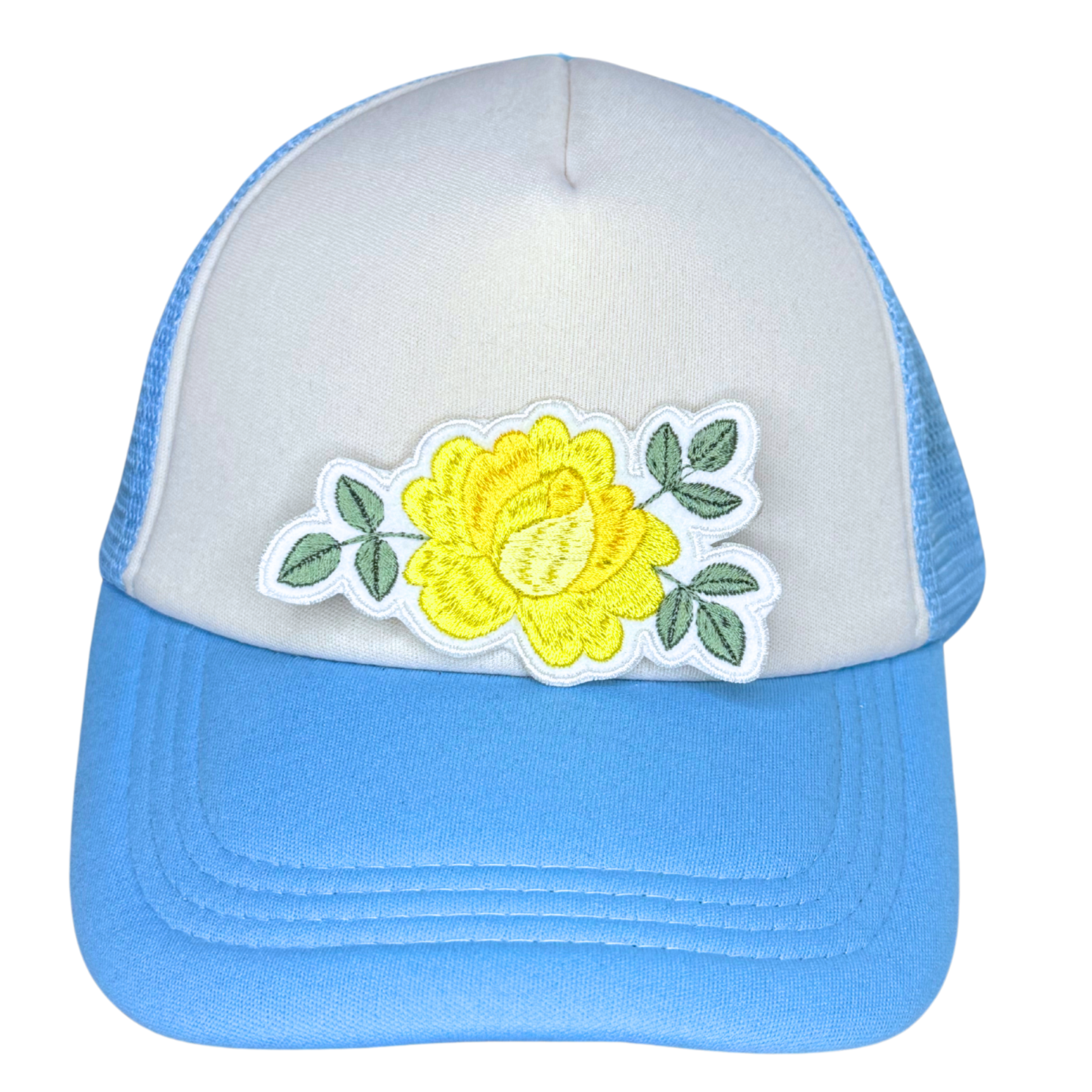 Yellow rose patch ironed onto white and blue trucker hat

