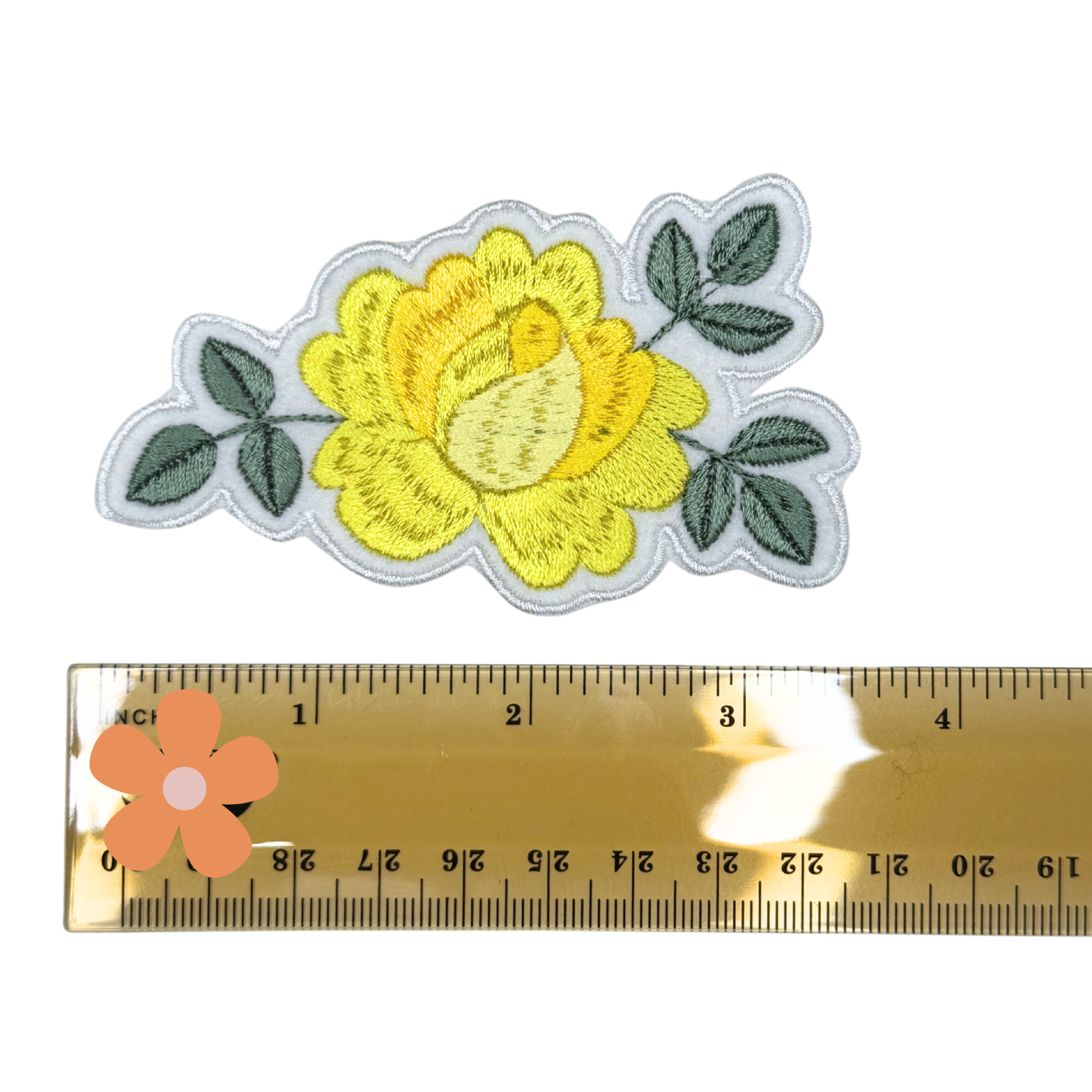 Yellow rose patch shown next to ruler for size referenc