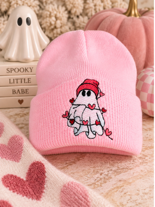 Youth pink embroidered ghost beanie styled with pink Halloween decor